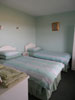 two single beds in two bedroom house